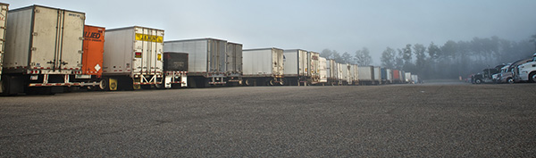 A row of trucks at a truckstop