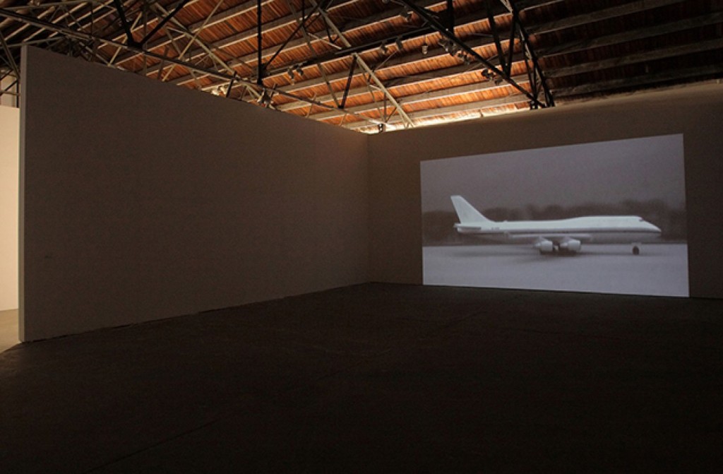 Abstract photo of a plane projected on a blank wall